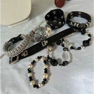 Group of seven black tone bracelets